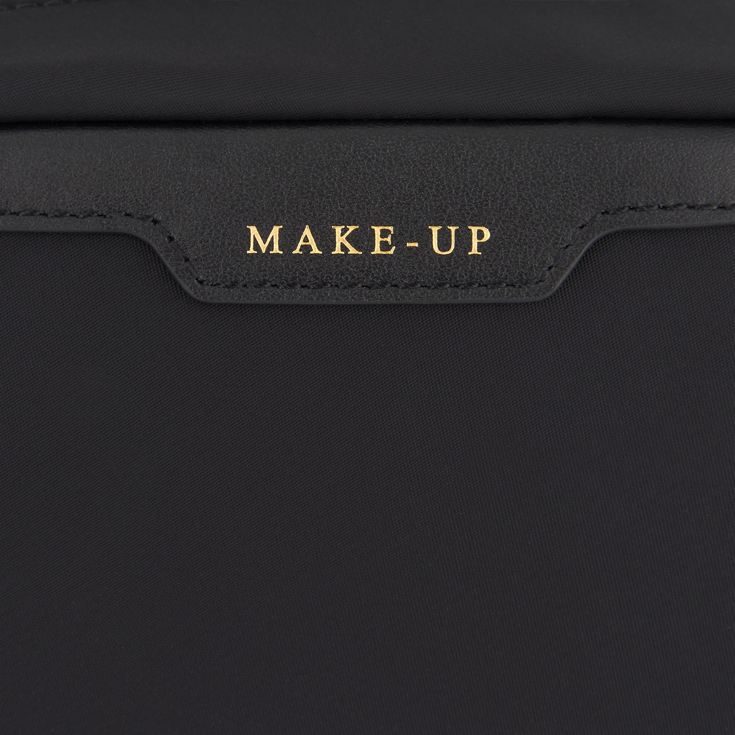 Make-Up Folio -

                  
                    Regenerated ECONYL® in Black -
                  

                  Anya Hindmarch UK
