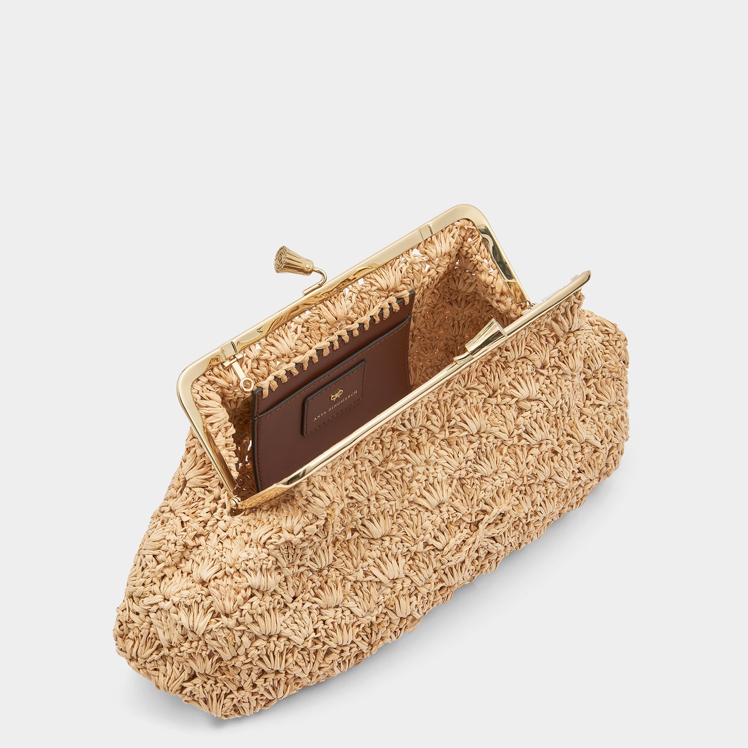 Large Maud Bow Clutch -

                  
                    Raffia in Natural -
                  

                  Anya Hindmarch UK
