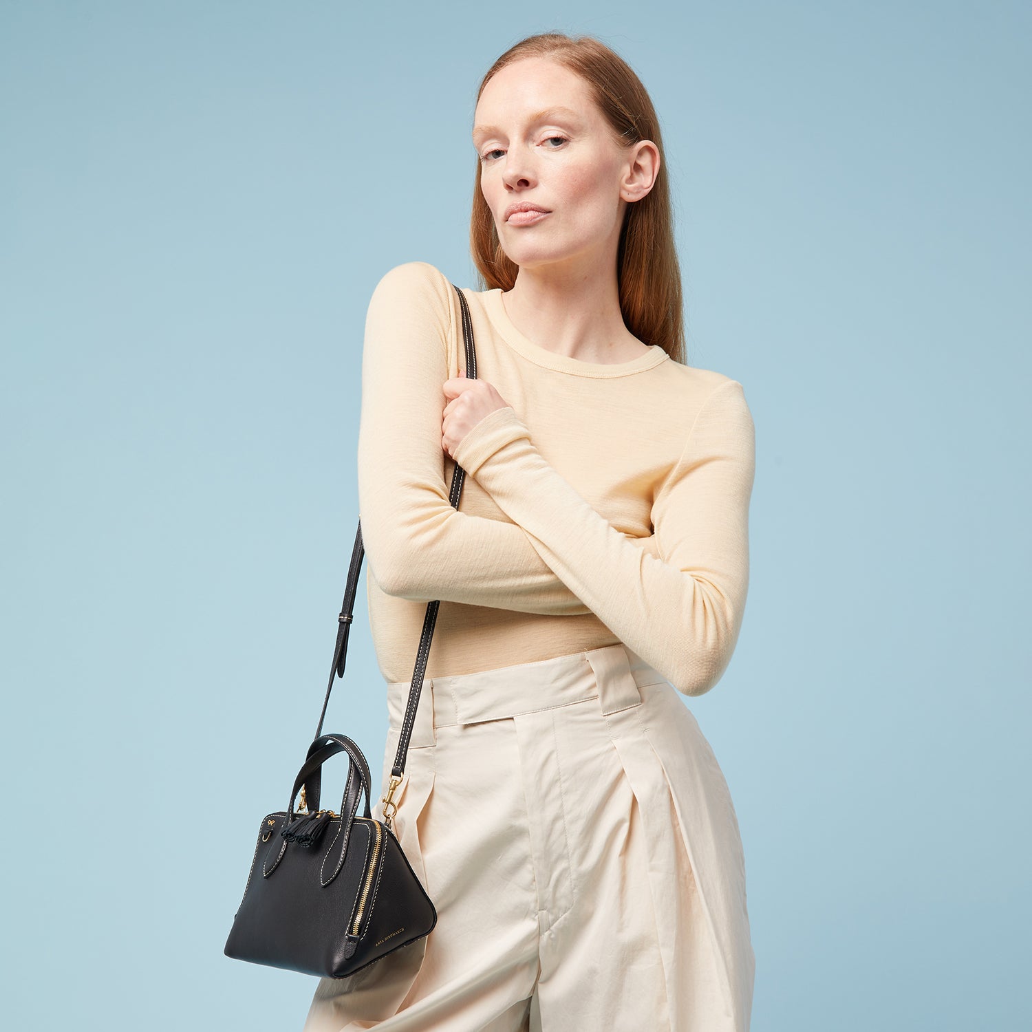 Small Wedge Cross-body -

                  
                    Calf Leather in Black -
                  

                  Anya Hindmarch UK
