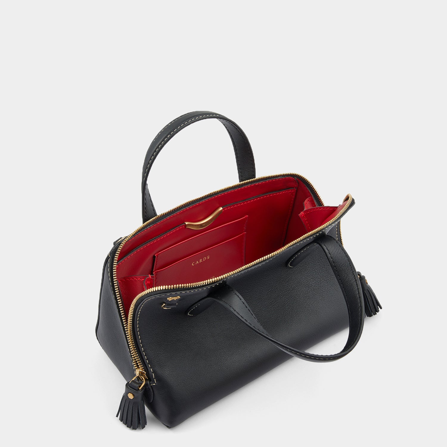 Small Wedge Cross-body -

                  
                    Calf Leather in Black -
                  

                  Anya Hindmarch UK
