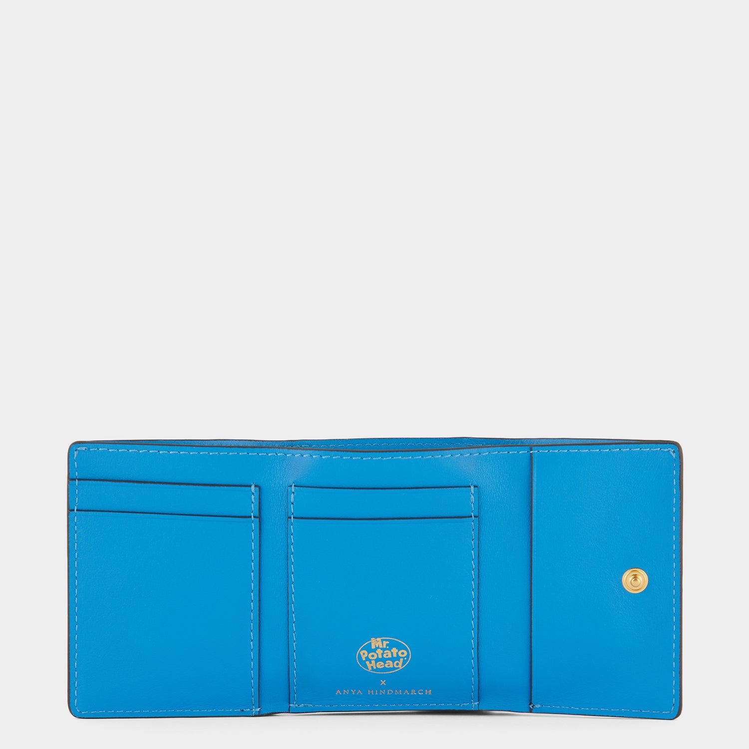 Mr Potato Head Mini Trifold -

                  
                    Capra Leather in Ink -
                  

                  Anya Hindmarch UK
