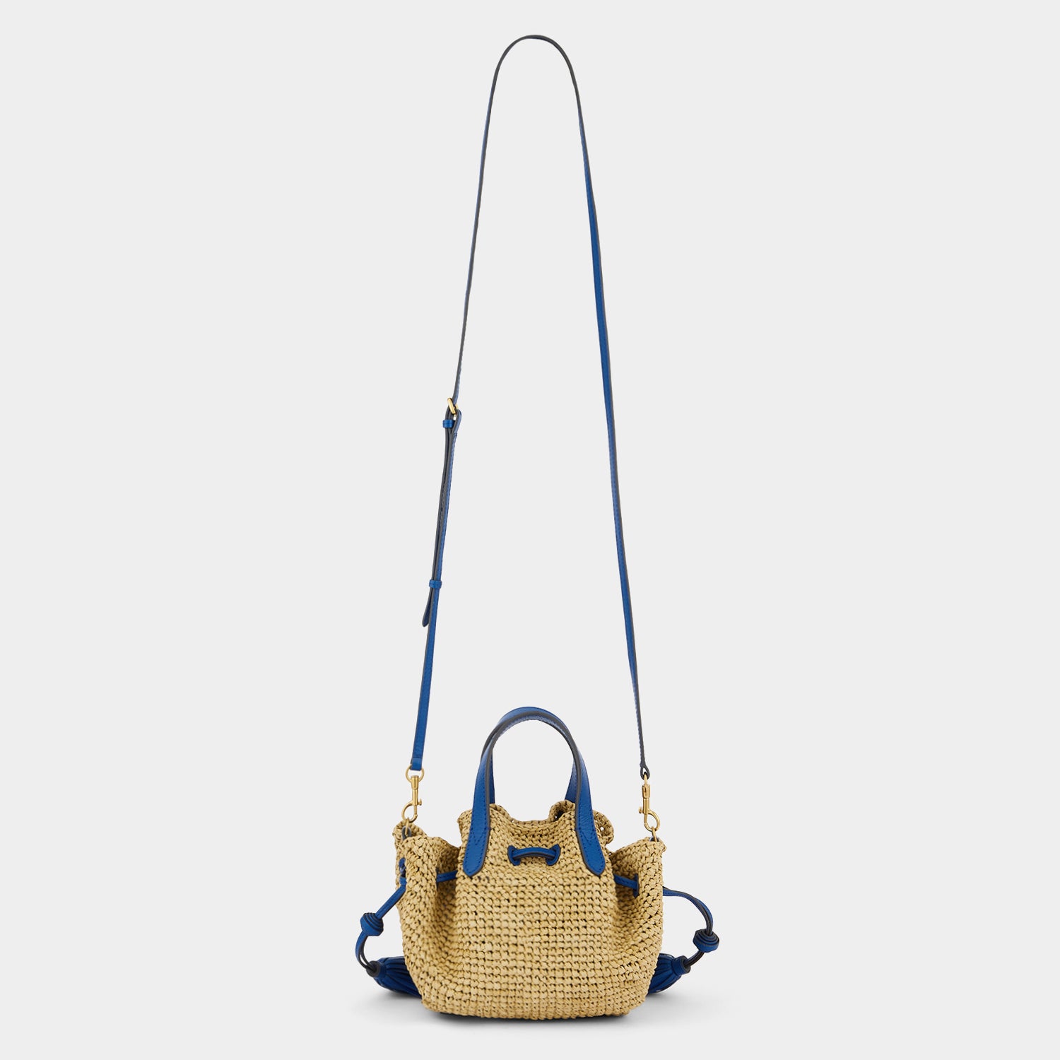 Raffia Drawstring Small Tote -

                  
                    Leather in Electric Blue -
                  

                  Anya Hindmarch UK
