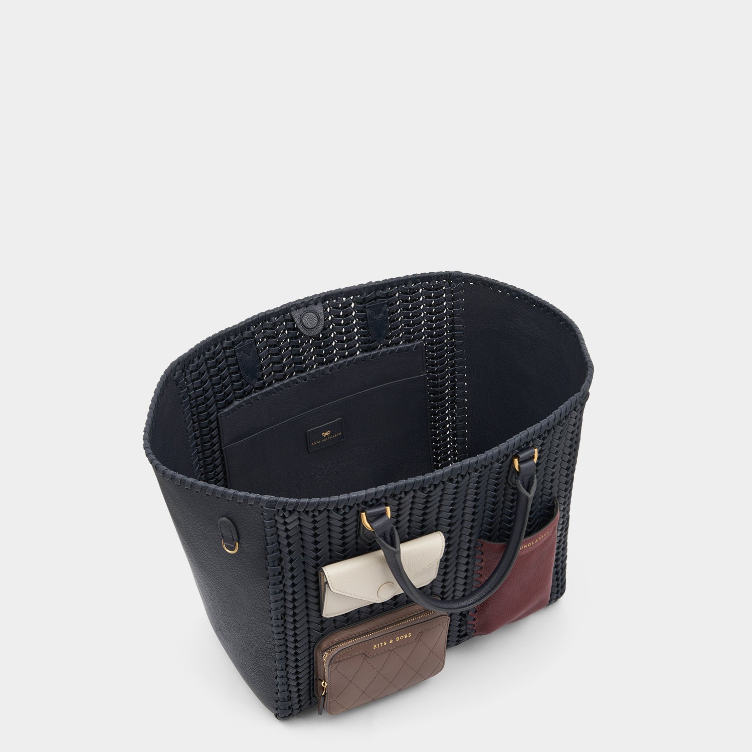 Neeson Multi Pocket Square Tote -

                  
                    Capra Leather in Marine -
                  

                  Anya Hindmarch UK
