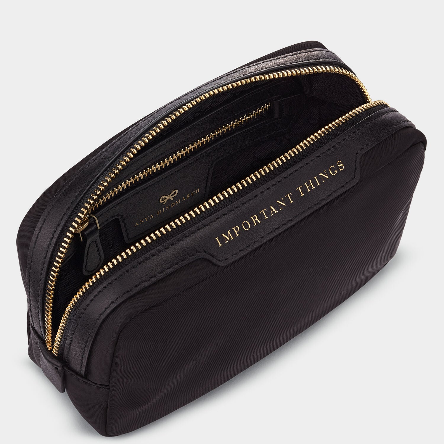 Important Things Pouch -

                  
                    ECONYL® Regenerated Nylon in Black -
                  

                  Anya Hindmarch UK
