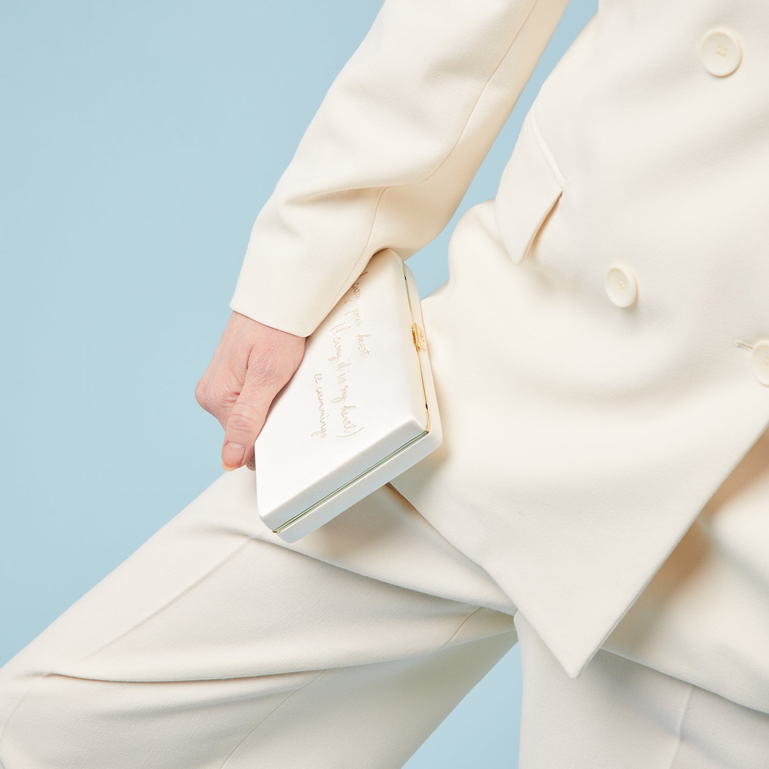 'I carry your heart' Clutch -

                  
                    Recycled Satin in Ivory -
                  

                  Anya Hindmarch UK
