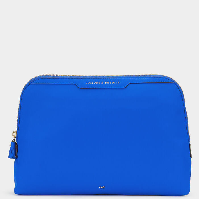 Lotions and Potions Pouch -

                  
                    ECONYL® in Electric Blue -
                  

                  Anya Hindmarch UK
