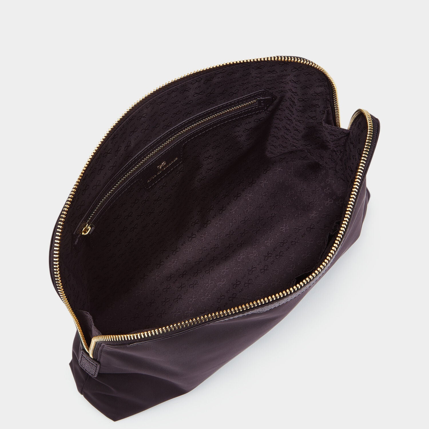 Lotions and Potions Pouch -

                  
                    ECONYL® in Black -
                  

                  Anya Hindmarch UK
