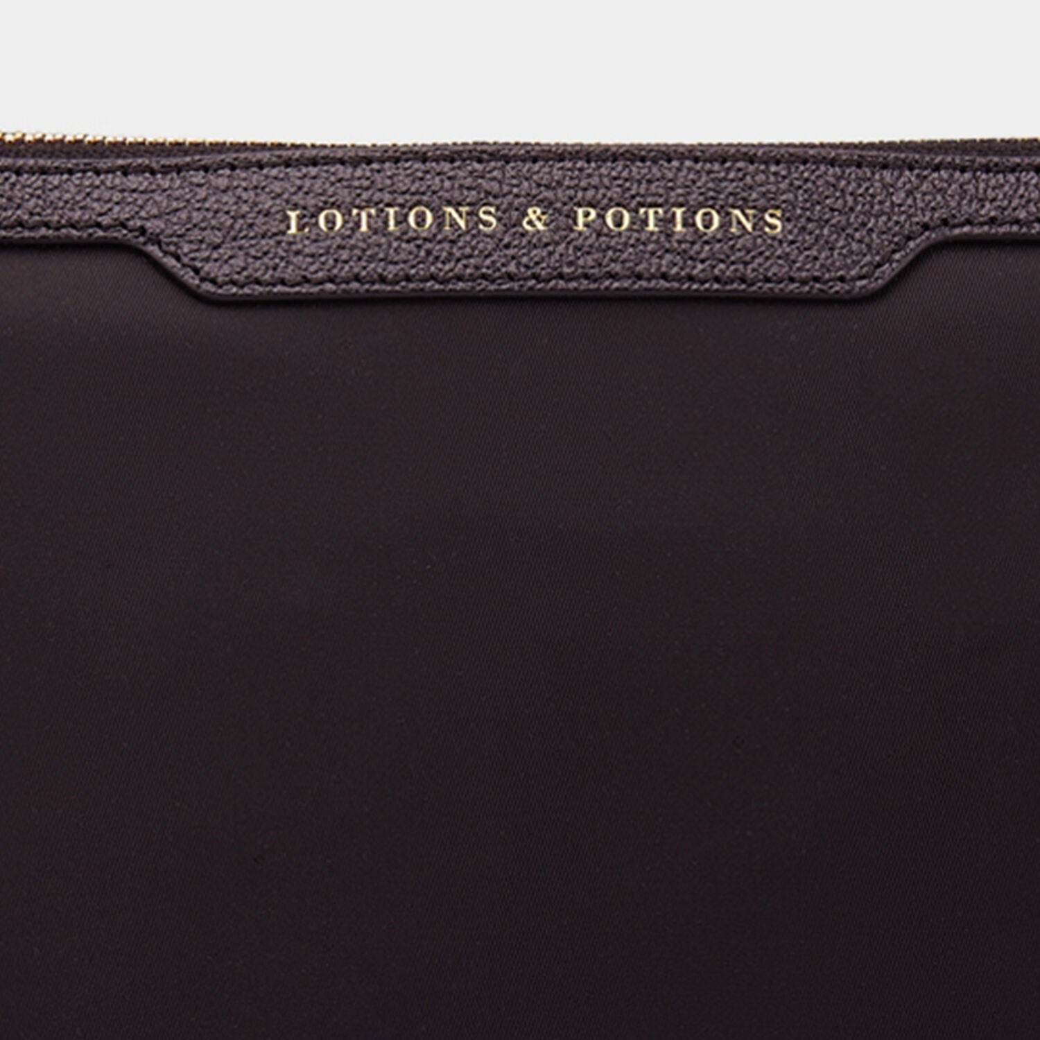Lotions and Potions Pouch -

                  
                    ECONYL® in Black -
                  

                  Anya Hindmarch UK
